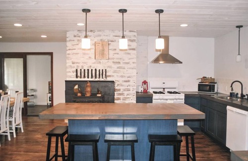 Newaygo House | Your lakeside story, powered by paddles and perfect moments.