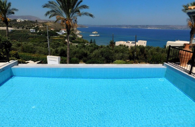 4 Bedrooms, perfect sea views, Infinity pool, Hot tub, Walk to beach & tavernas.