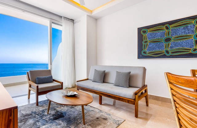 4th-floor oceanfront condo with balcony, outdoor pool, ocean views & AC