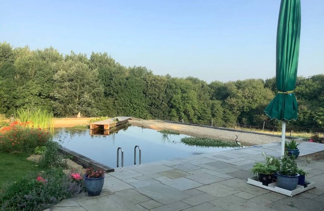 A Cottage and The Railway Carriage with use of a Natural Pool.