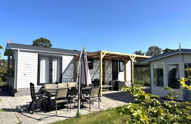A modern chalet on a spacious plot with a garden shed and electricity for your e-bikes.