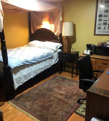 A secluded bedroom with a private full bathroom
