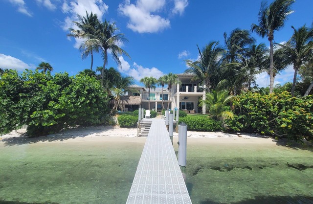 A waterfront oasis with soft white sand beach, pool and intracoastal dock views.