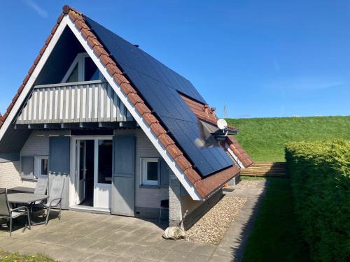 am Deich 6 pers House with a private terrace behind a dike by the Lauwersmeer