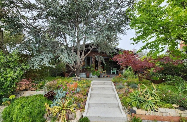 An elegant Craftsman's house with a modern garden studio and a huge backyard