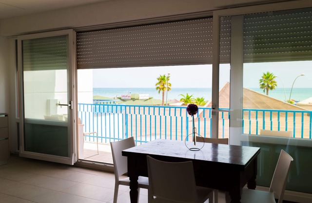 Apartment first row sea, air conditioning, flat screen TV,