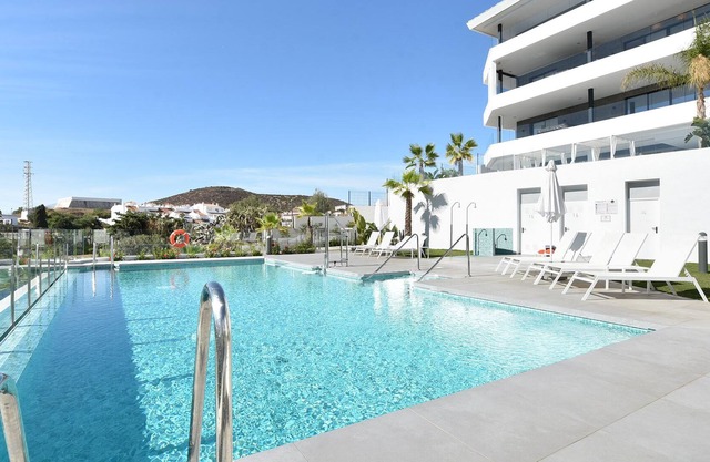 Apartment walking distance beach and centre, onsite fitness and playground.