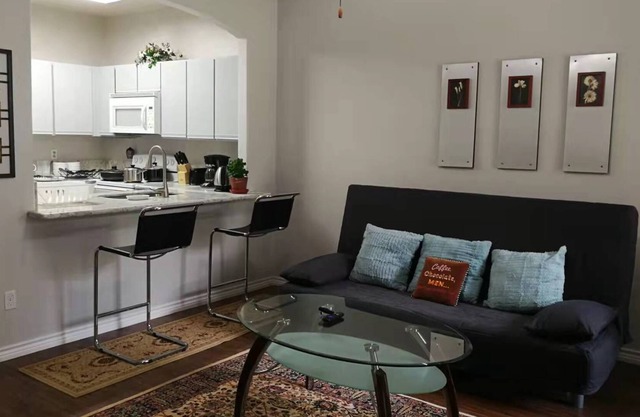 back walking trail with private garage and patio-2minutes to highway