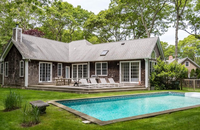Beach nearby and pool in your backyard in this family-friendly modern home