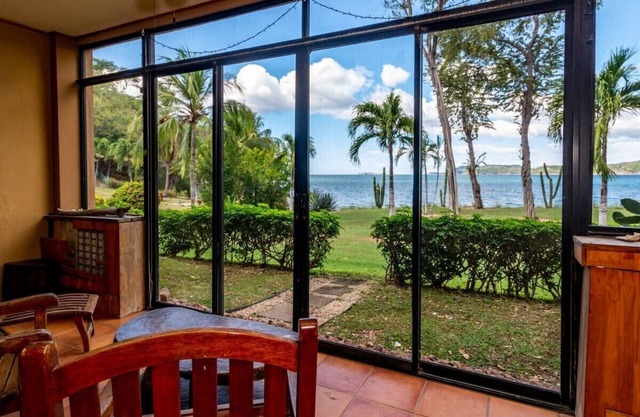 Beachfront Condo with Warm, Rustic Interiors & Direct Access to Playa Flamingo