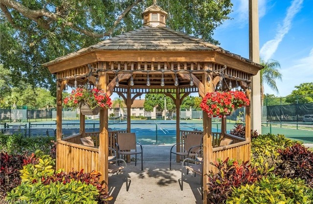 Beautiful top-floor corner unit with large lanai overlooking golf course & pond.