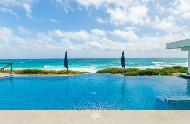 Brand New 12 Suite Villa directly on the waters edge of the Caribbean Sea