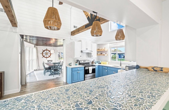 Breezy Waterfront Pool House Steps from the Beach!