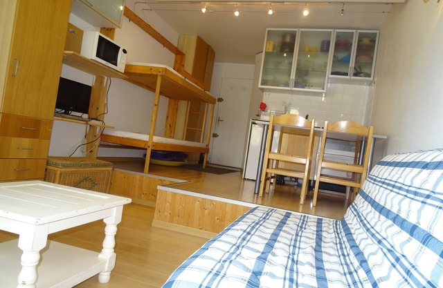 bright studio, open view, children's village.