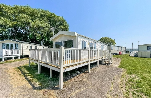 Caravan with decking at Coopers Beach Holiday Park ref 49012CW