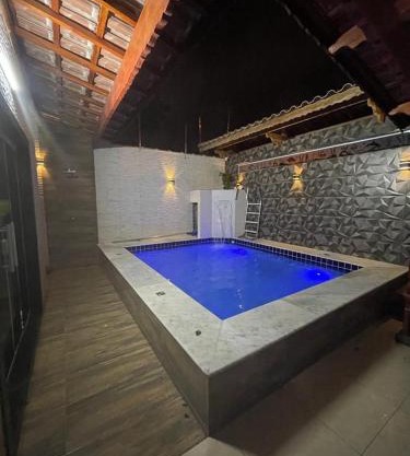 Casa com piscina em praia grande piscina aquecida