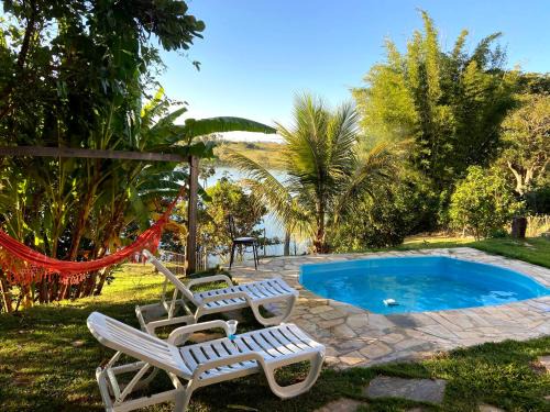 Casa com piscina fundo pra represa e AR Condicionado CasinhaBrancaDeVaranda