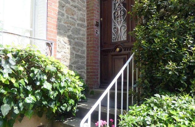 Centrally Located Traditional Townhouse With Modern Amenities and Pretty Garden
