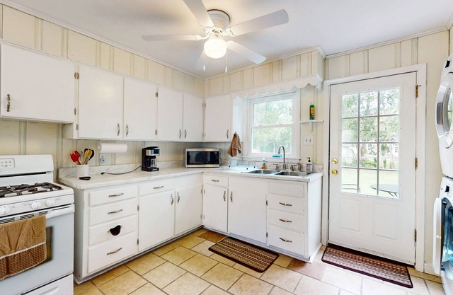 Centrally located with large yard, electric fireplace & w/d
