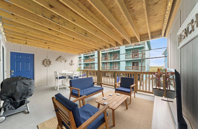 Charming 2-bedroom condo with large covered front porch and partial ocean view!