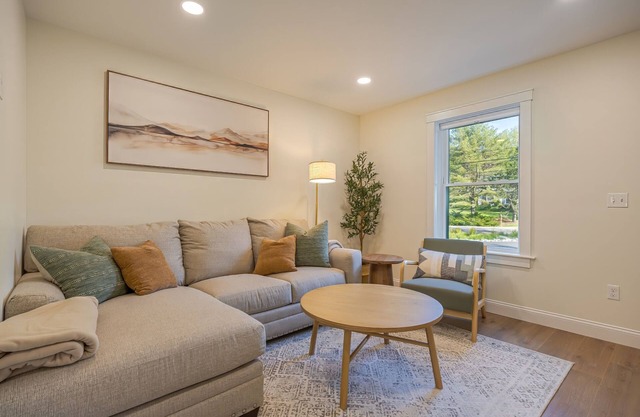 Charming 2-bedroom apartment nestled in a quiet neighborhood with nearby stream.