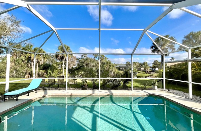 Charming 2BR waterfront retreat with serene views and heated pool