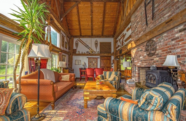 Charming barn ski house with exposed rustic beams and cathedral ceilings.