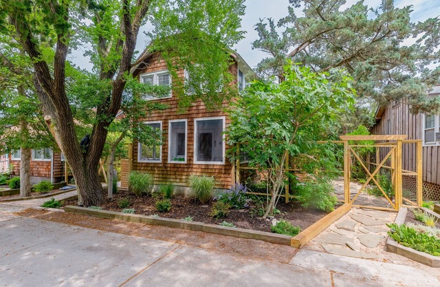 Charming home steps from beach with deck, outdoor shower, grill, & bikes