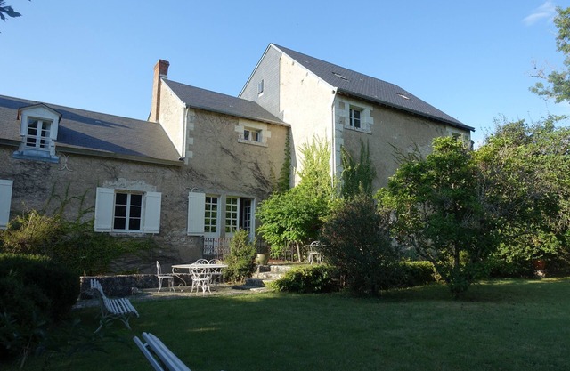 Charming riverside mill with island