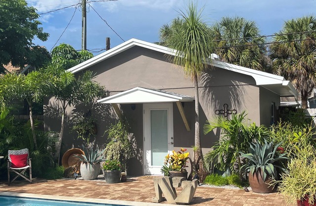 Chill on the patio overlooking the pool & lush gardens & grill your dinner!