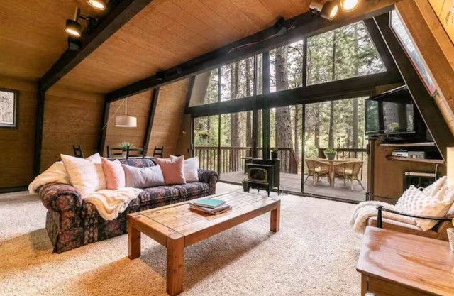Classic Tahoe a-frame cabin forest view floor2ceiling window. Near Northstarn