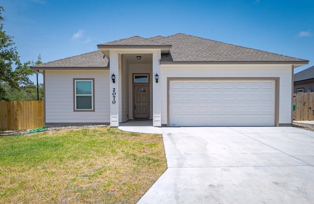Coastal gem with spacious backyard and garage