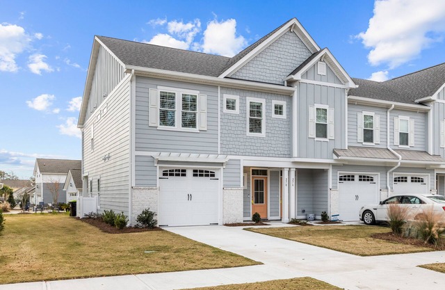 Coastal townhome with outdoor living, central AC, washer/dryer, & pool access