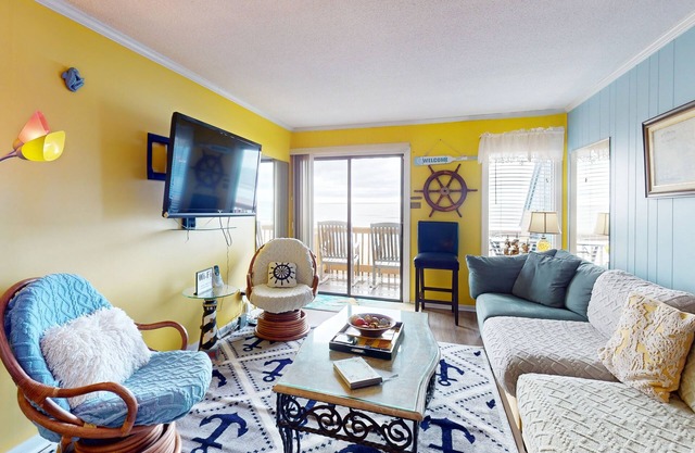 Colorful ocean view condo with pool, central AC, & private washer/dryer