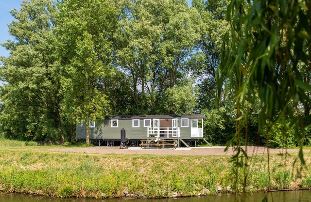 Completely new Pipowagen on grounds of monumental farmhouse overlooking pond.