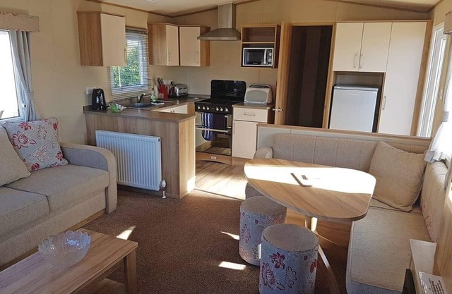 Contemporary 12ft-wide caravan with one double and two twin.