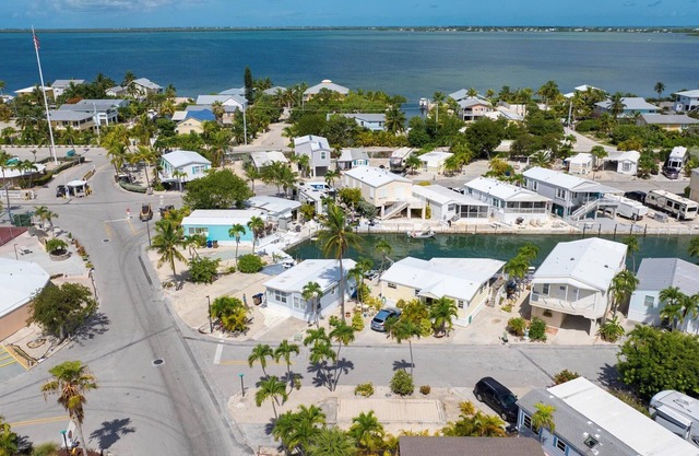 Corner RV Lot with Lagoon Views, Palm Trees, and Steps to Pool & Amenities