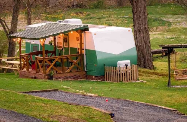 Cotch under a sugar maple tree w/firepit, swing and outdoor shower