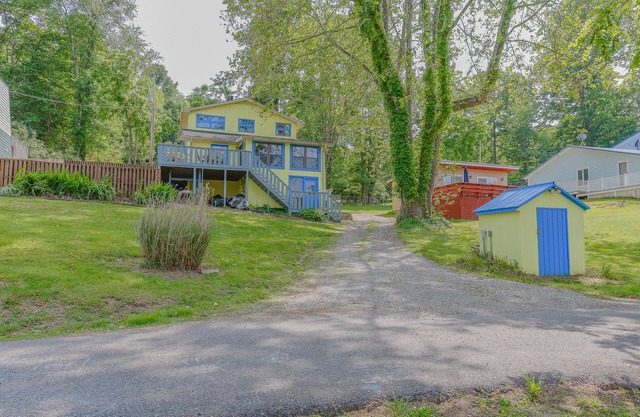 Cozy lakefront retreat with private dock, scenic views, updated interiors and serene outdoor seating