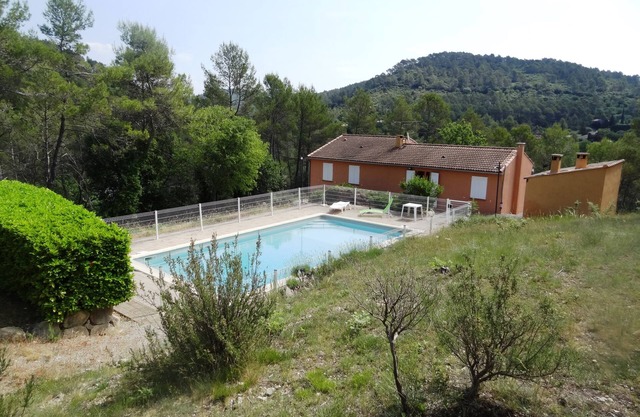 Detached villa with shared pool and summer kitchen.