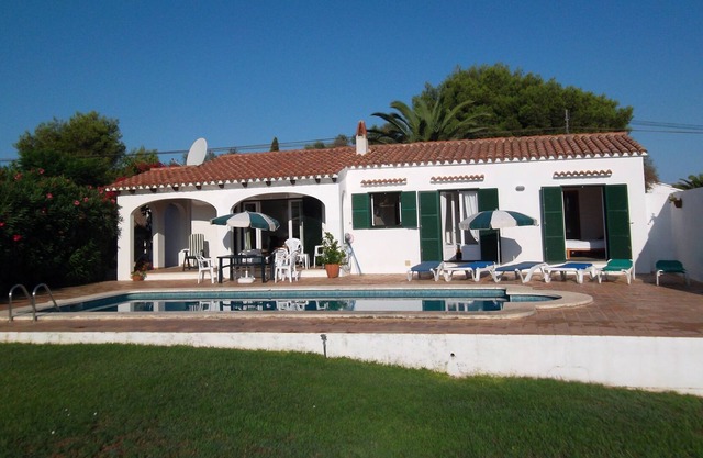 Detached villa with private swimming pool in landscaped gardens.
