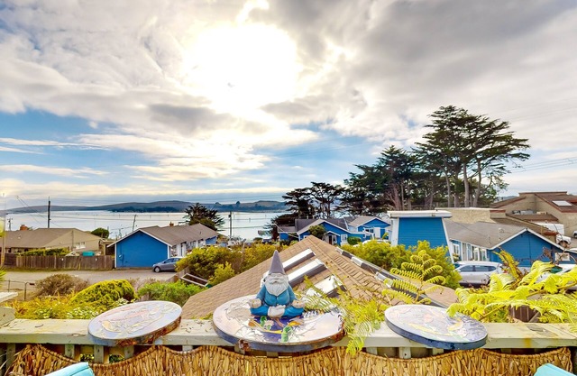 Dog-friendly coastal stay with large balcony, water views, & wood fireplace