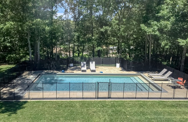 Dog-friendly Hamptons home with private pool, AC, & private W/D - near lake