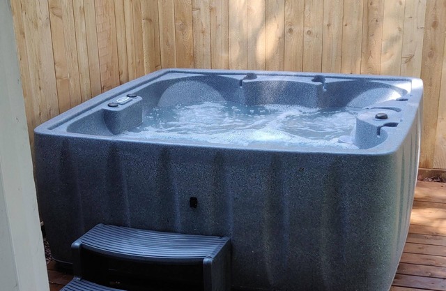 Dog-friendly home near the beach - private hot tub, wood-burning fireplace & W/D