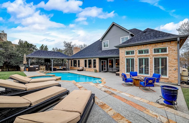 Dog-friendly home with fenced yard, pool, office, piano, & W/D