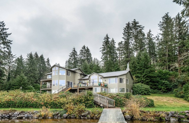 Dog-friendly waterfront house w/a private hot tub, game room, & dock