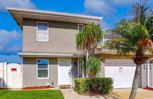 Dreamy duplex with dog-friendly fenced yard, private outdoor living, AC, & W/D