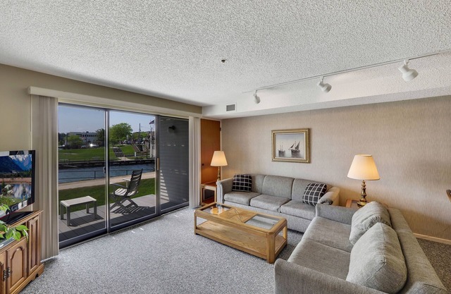 Edgewater #119 | Water Views + Private Balcony | Pool, Hot Tub, Sauna | Patio