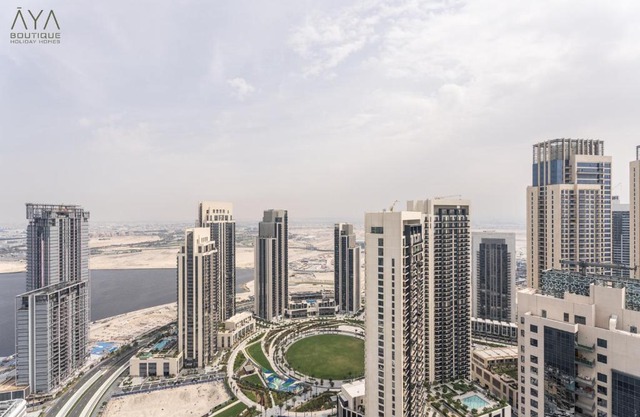 Elegant Luxury Apartment with Stunning Lake Views in Dubai Creek Harbour By ĀYA Boutique
