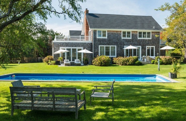Elegant Water Mill retreat with heated pool, terraces, and timeless.